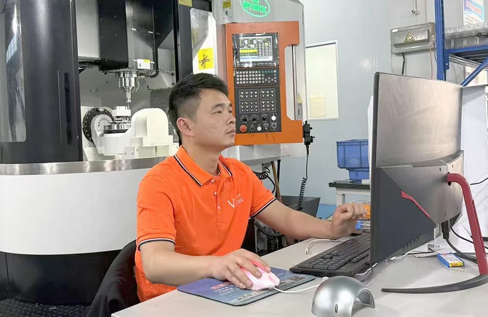 VOGUC operator working at a five-axis machining center