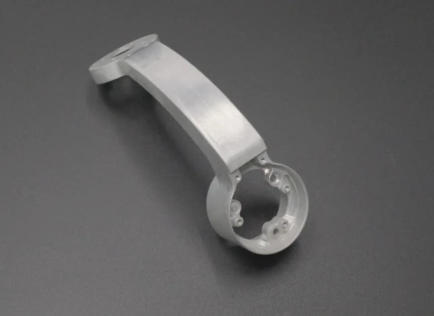 Curved mounting arm machining example
