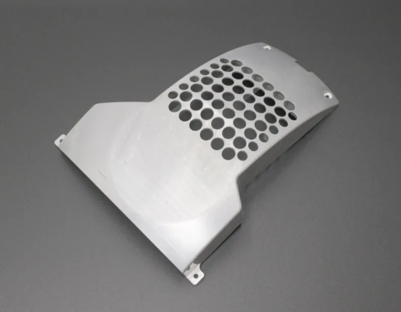 Perforated protective cover machining example