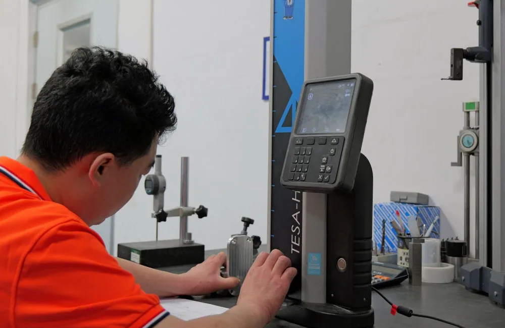 VOGUC technician checking a machined component