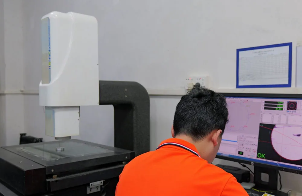 VOGUC technician reviewing dimensional inspection results