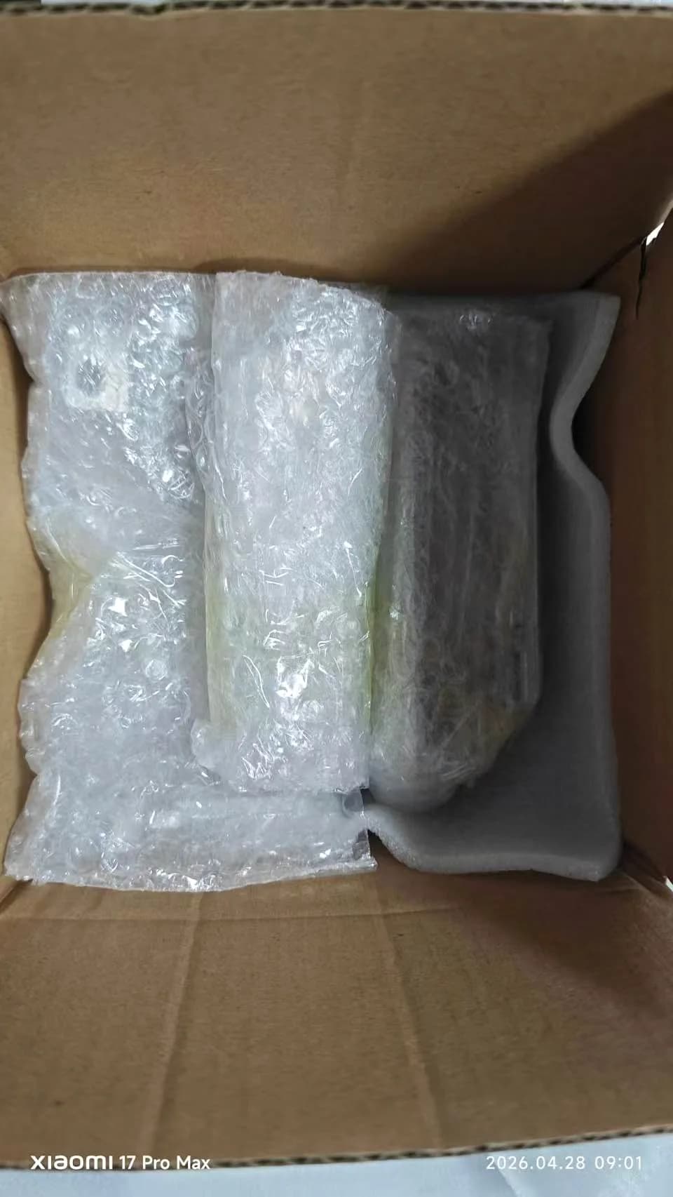 Foam and bubble-wrapped CNC components prepared for shipment